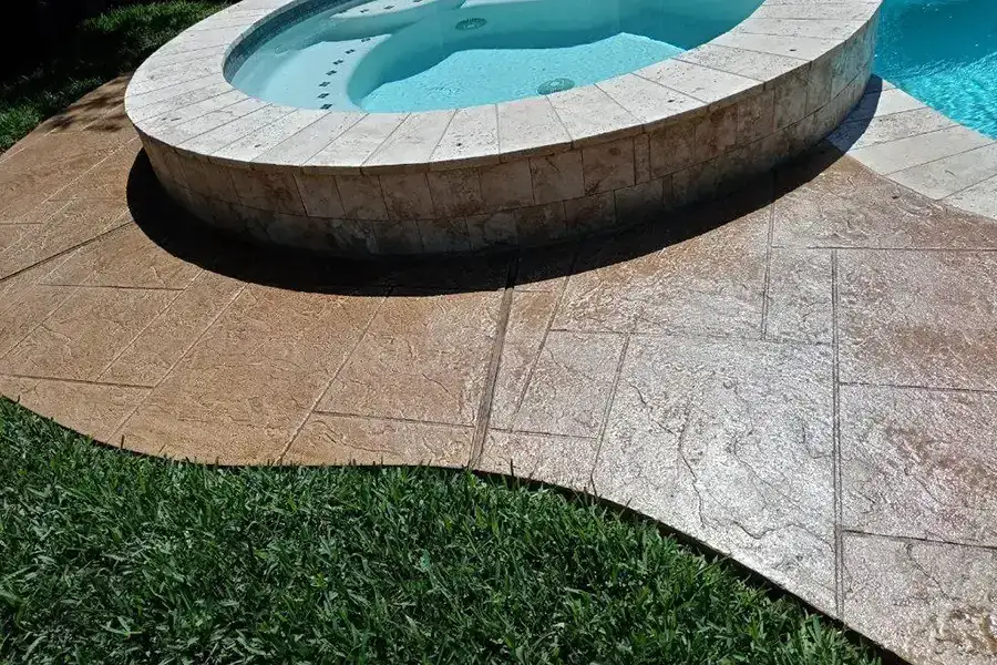 sealed concrete around pool and lawn